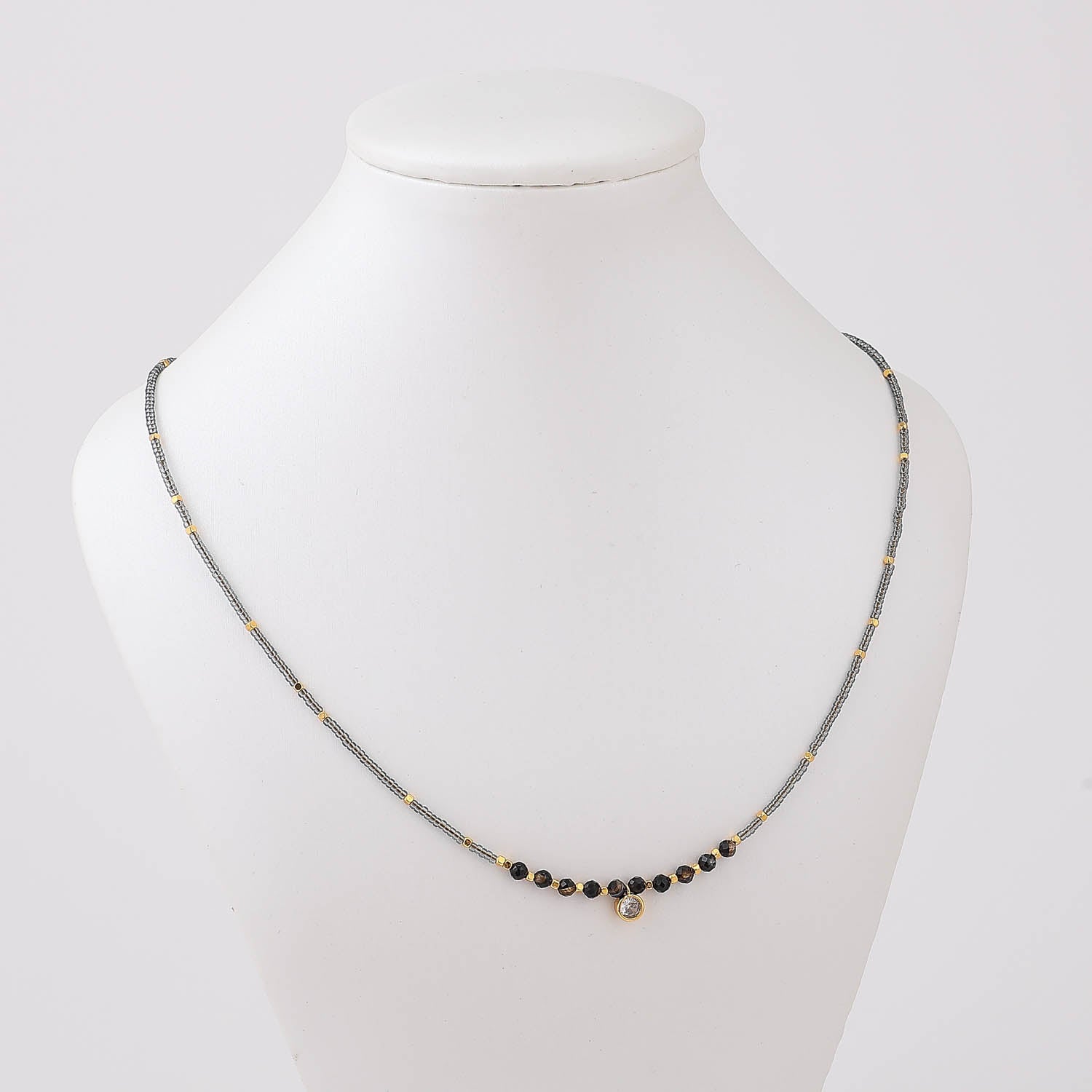 16" CAD CHAQUIRA GRIS / CHECOS MED / 1 PERLA AL CENTRO / DORADO