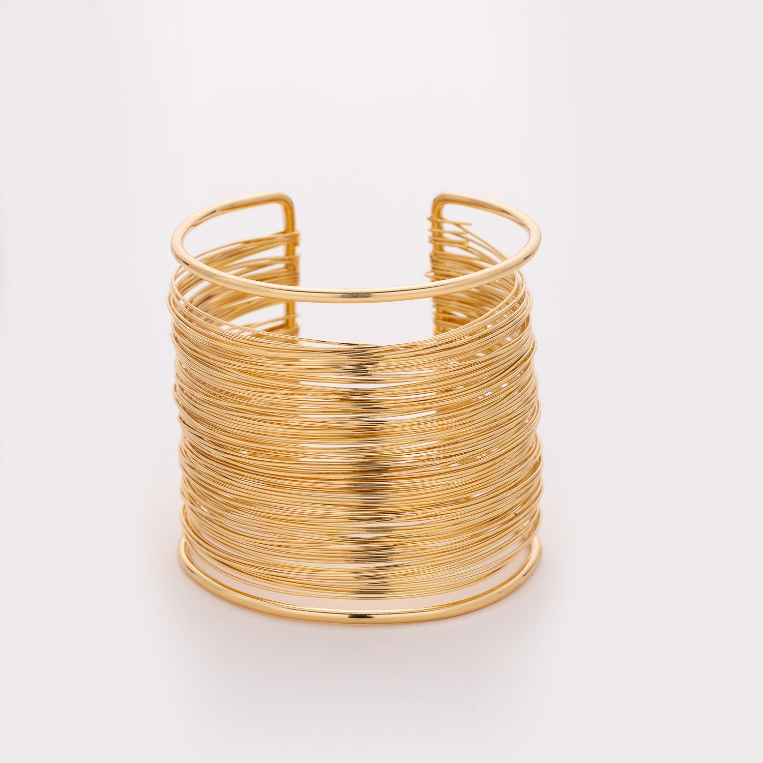 brazalete xxg rigido multilineas metal / dorado