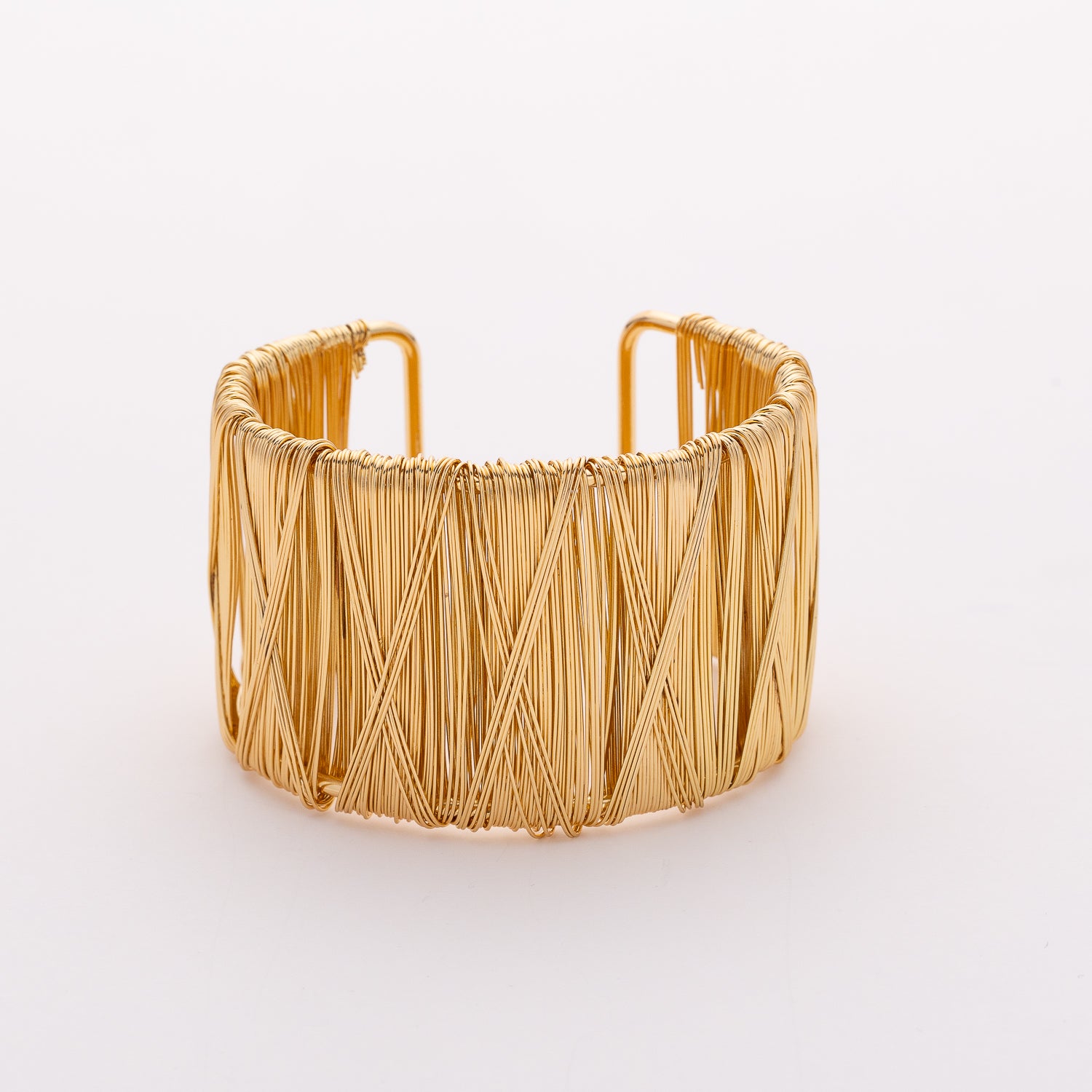 brazalete rigido ancho mediano abierto / 2 medios circulos tex trenzados / dorado