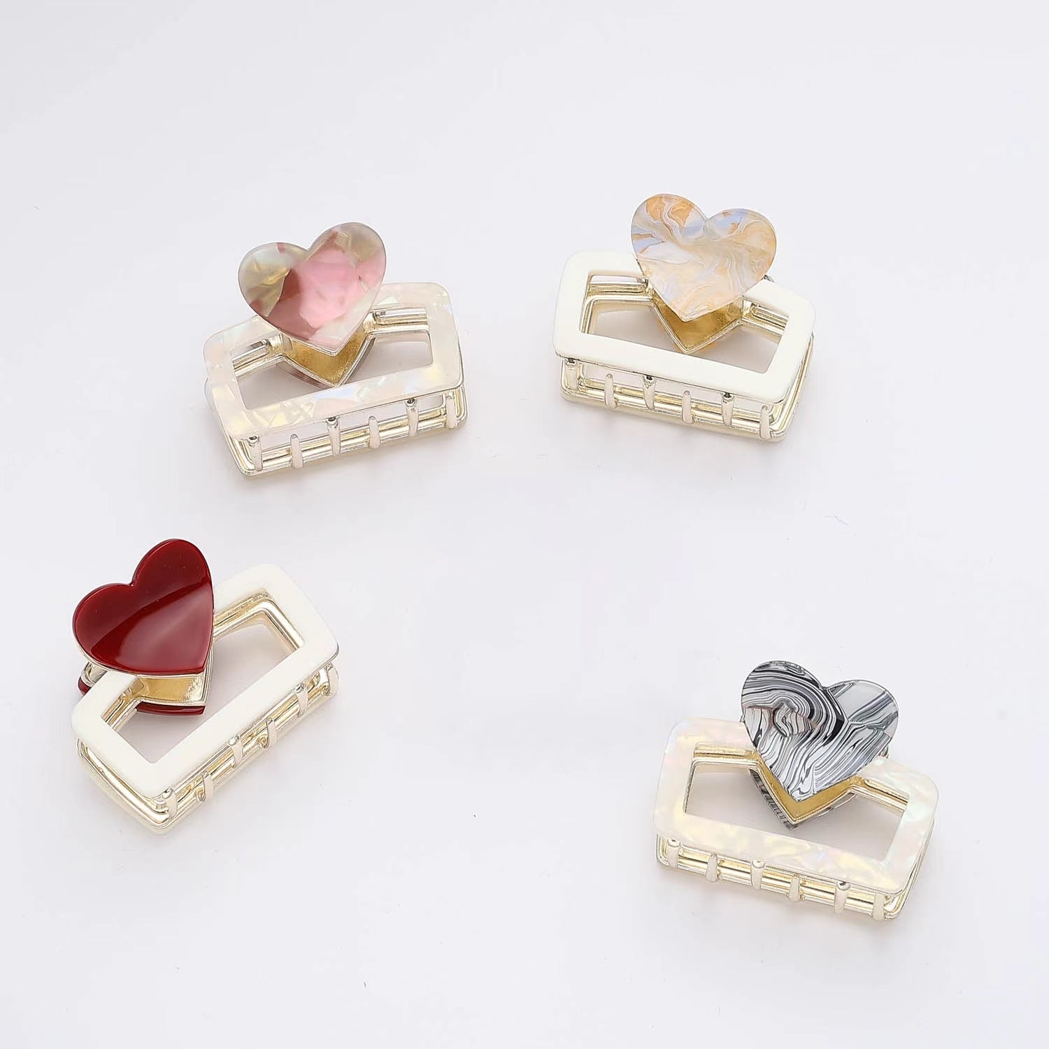 PINZA MED METALICA RECTANGULO CORAZON ESMALTE MARMOLEADO DORADO