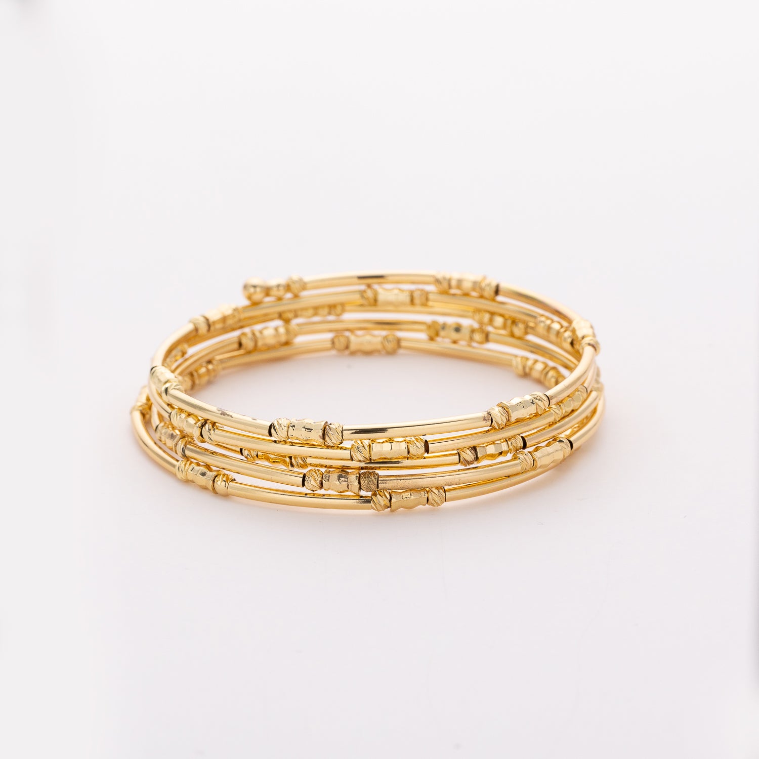 BRAZALETE / 5 LINEAS ELASTICAS / CANUTILLO DORADO LARGO Y TEX