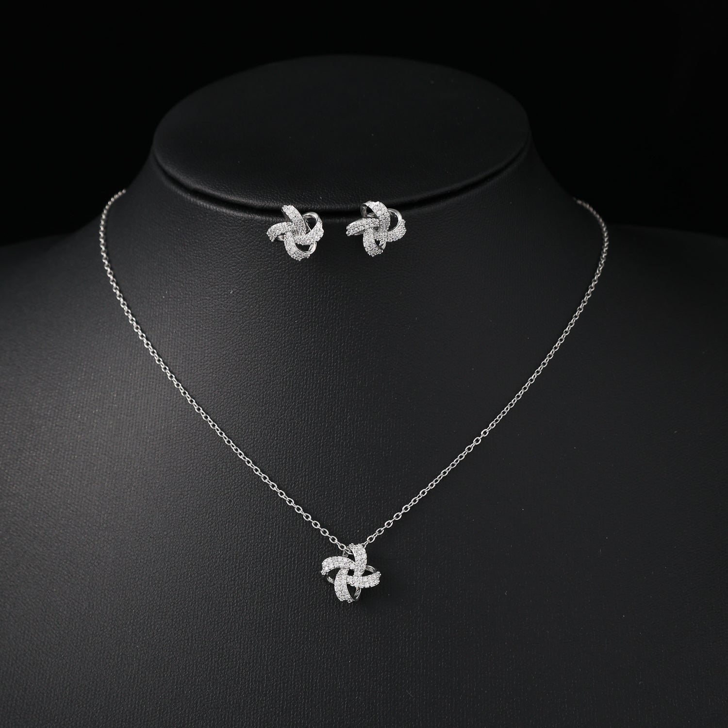 coll y are /cad del / dije moño en nudo cristal / arete moño / plata