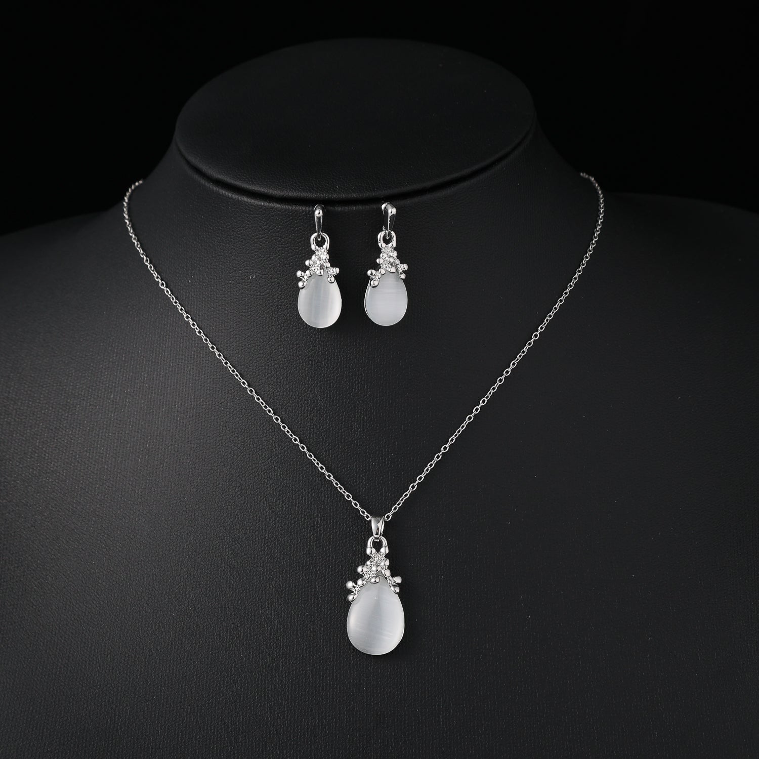 coll y are / cad del / dije gota ojo de gato blanco / base cristal / arete gota / plata