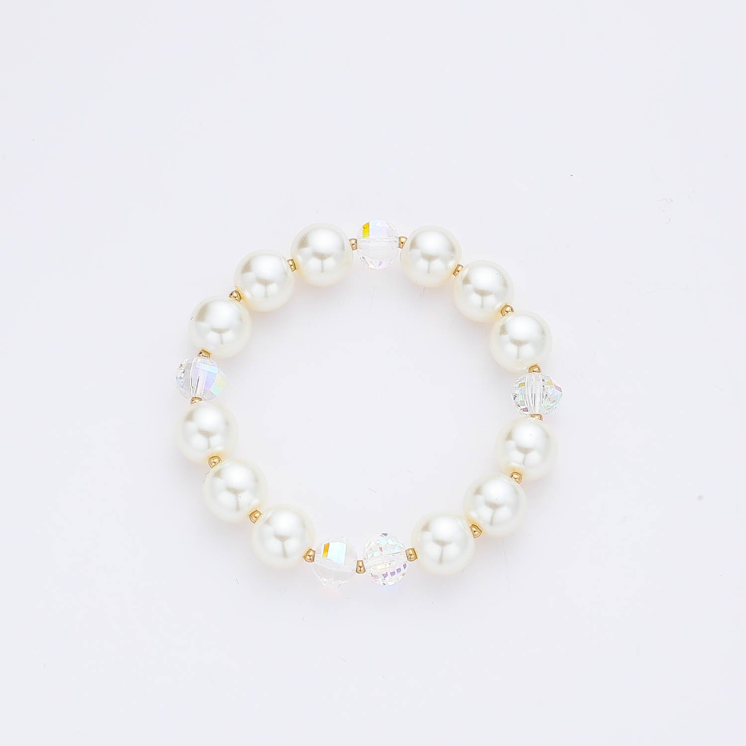 PULSERA RESORTE PERLAS APERLADAS  Y CHECOS