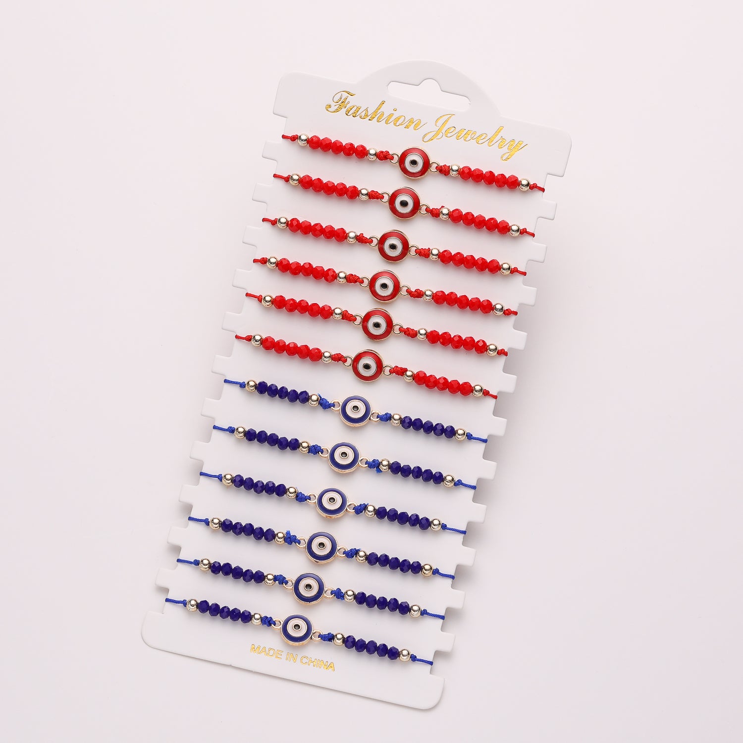 PULSERA HILO TEJIDO / CHECOS Y DIJE OJO