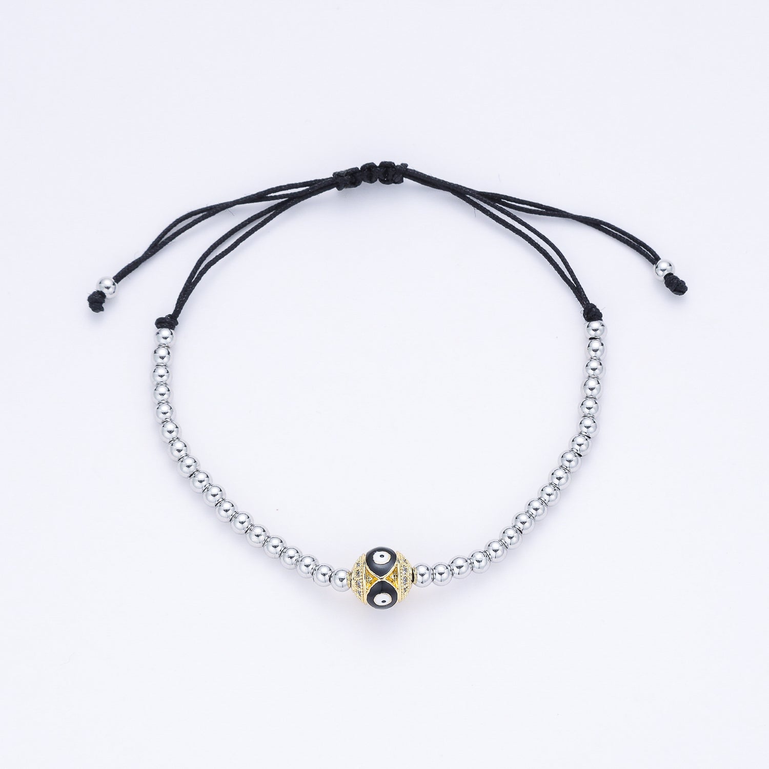 PULSERA HILO/ BOLITAS PLATA / BOLA DORADA TEX / OJO