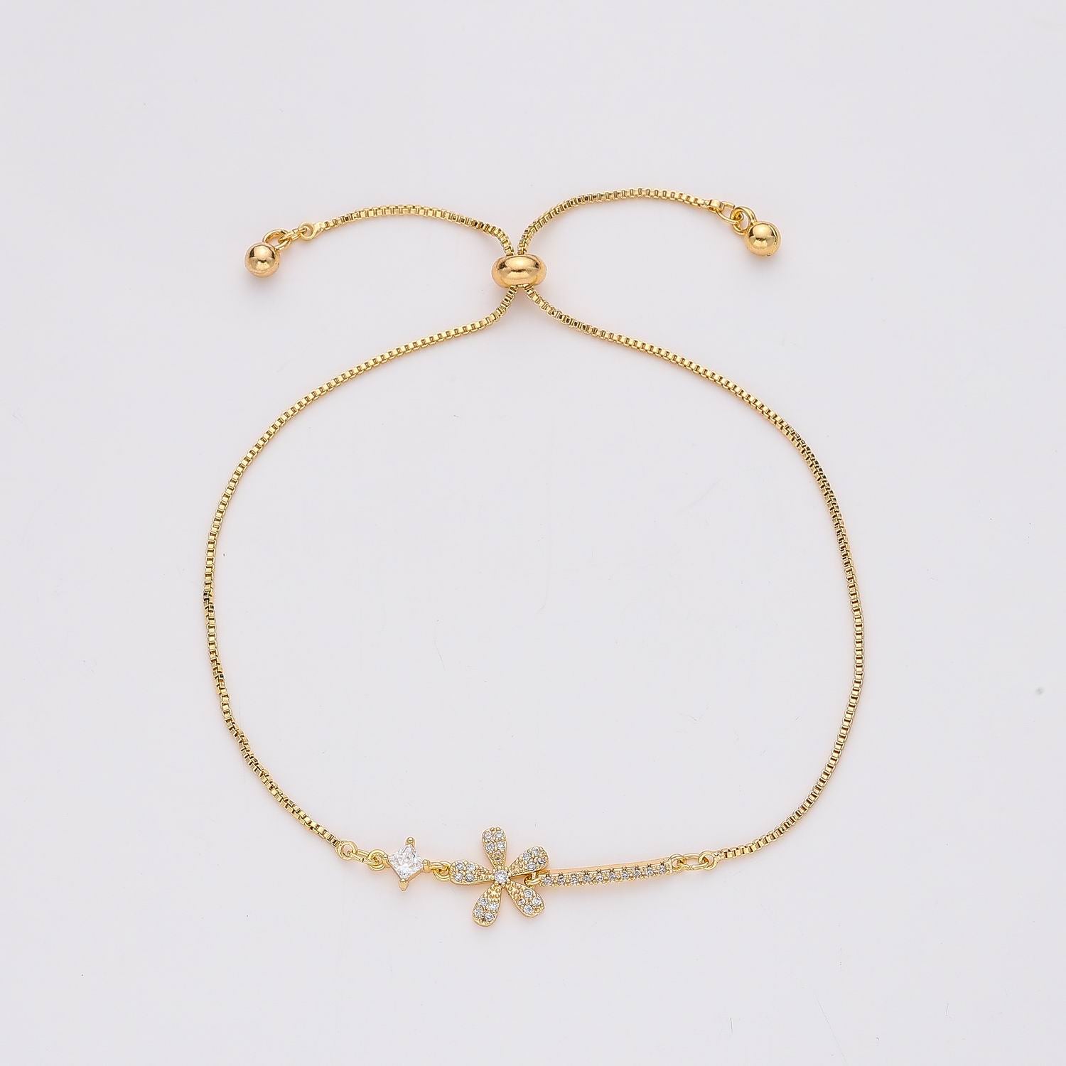 CAD BOX / FLOR CRISTAL / PALITO CRISTAL / BROCHE DESLIZANTE / DORADO