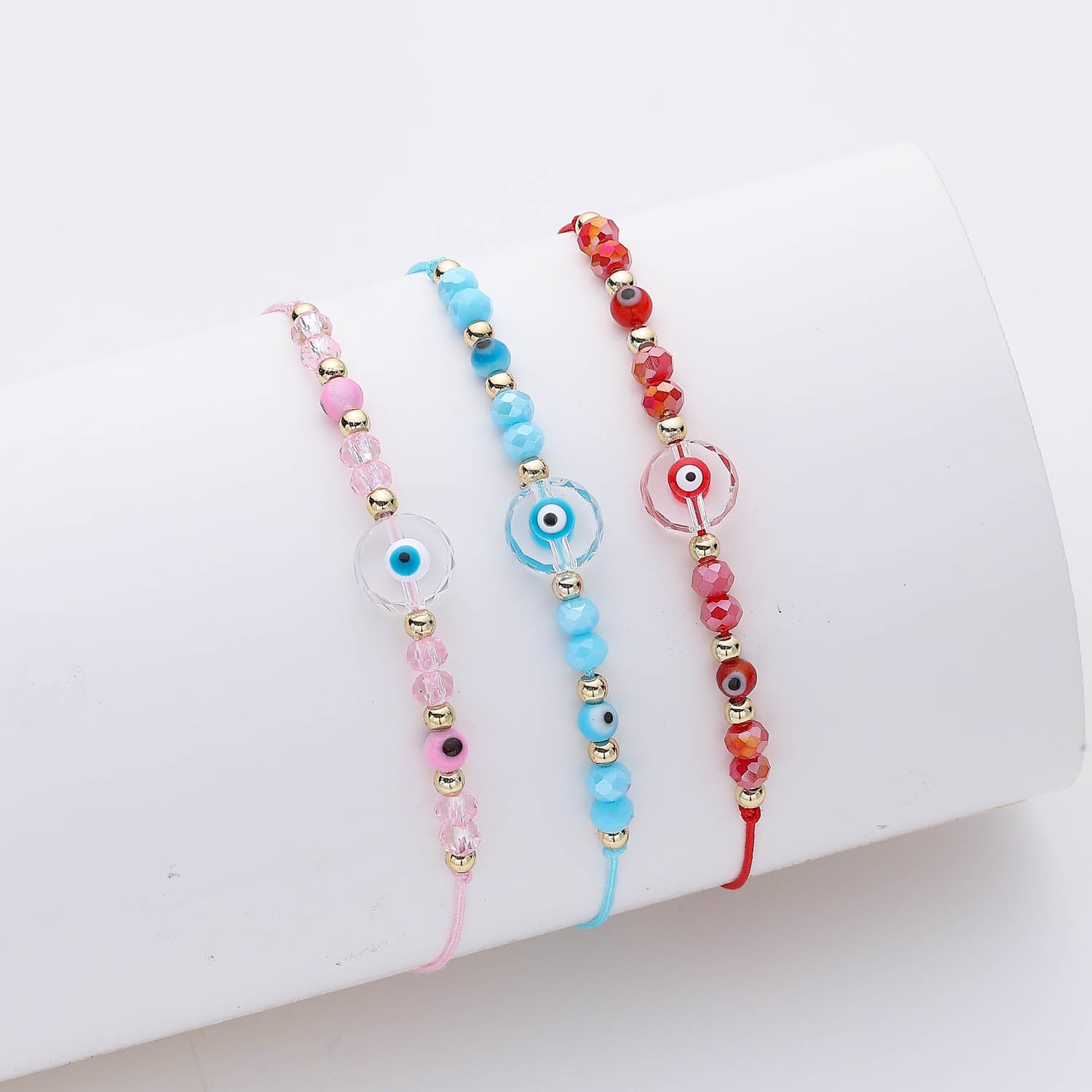 HILO / SWAROVSKI/CÍRCULO TRANSPARENTE OJO / COLOR