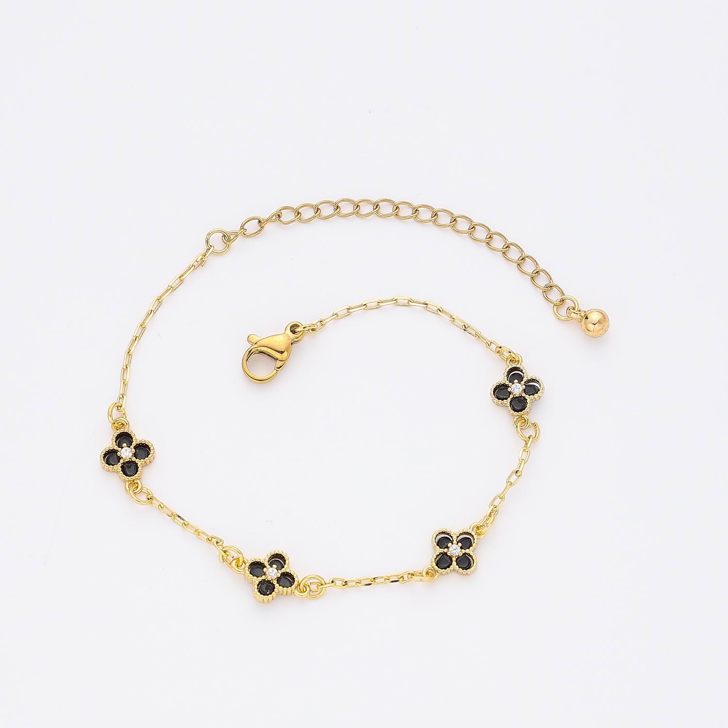 CAD DEL / 4 FLORES VAN / ESMALTE NEGRO / DORADO