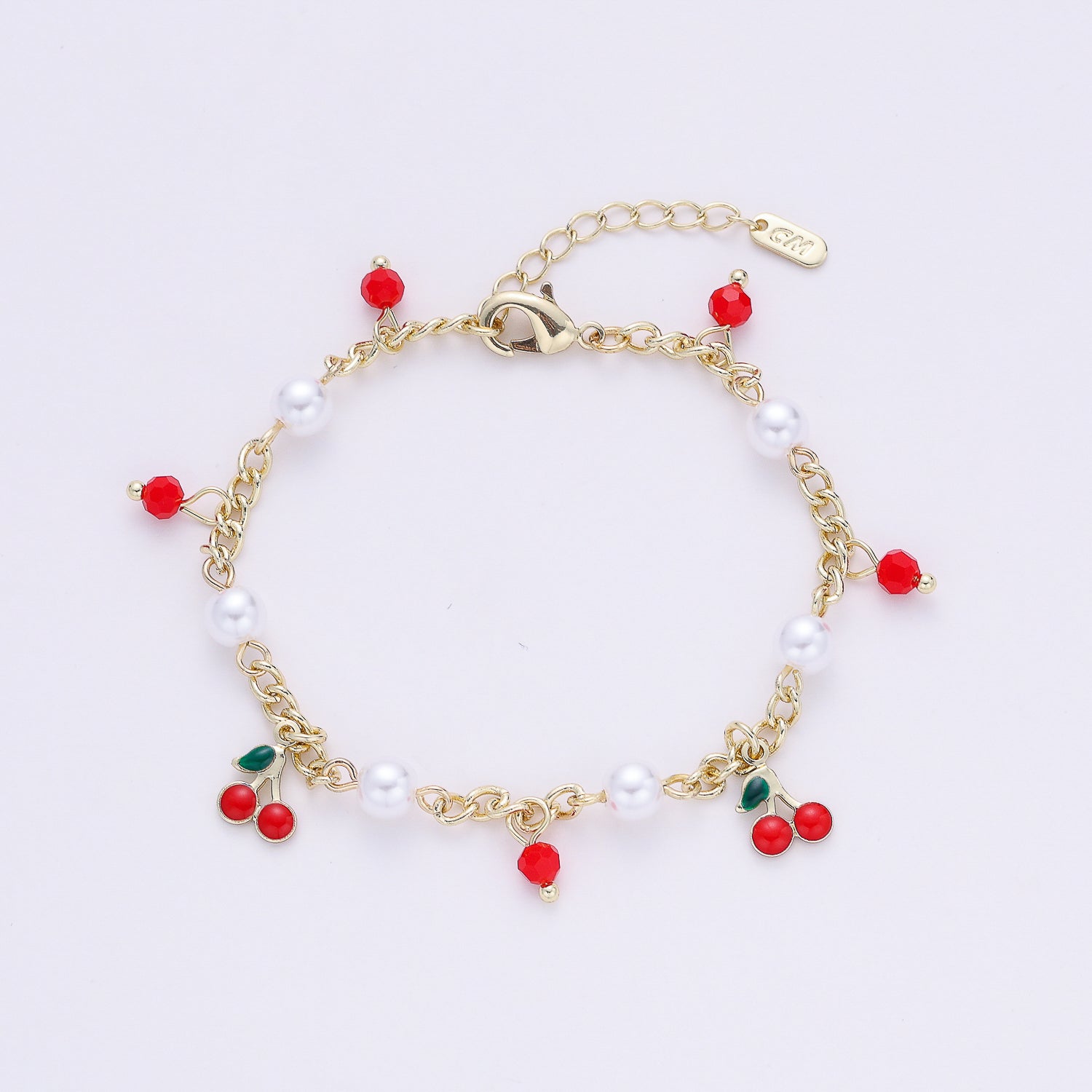 cad med eslabon perlitas / dijes cereza / dorado