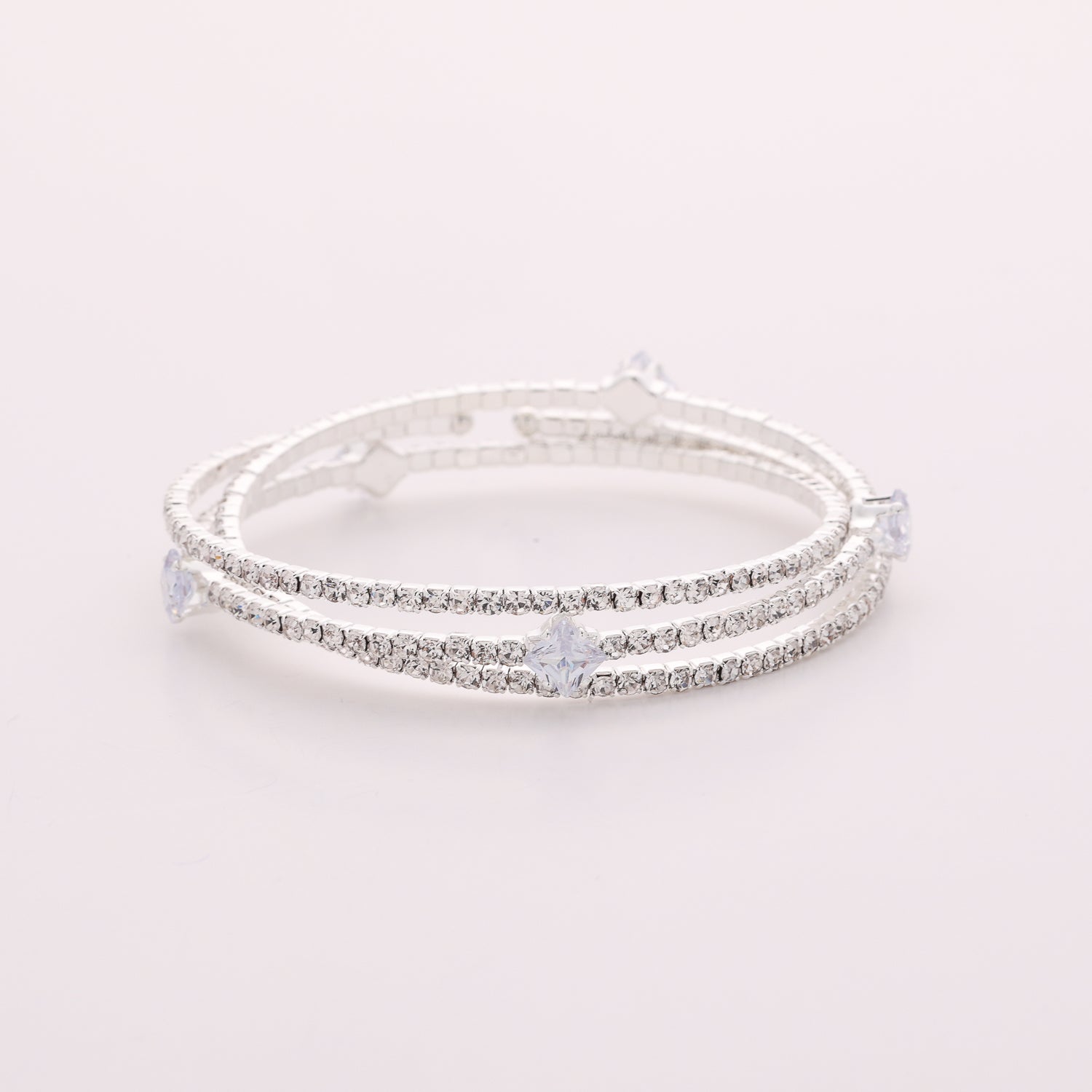 PULSERA EN RESORTE 3 LINEAS CRISTAL PLATA