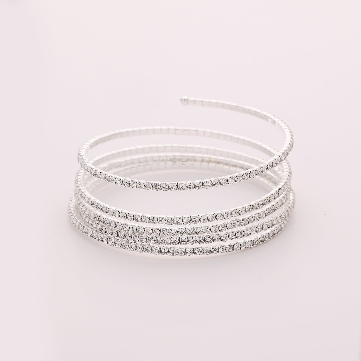 PULSERA  EN RESORTE 5 LINEAS CRISTAL DORADO