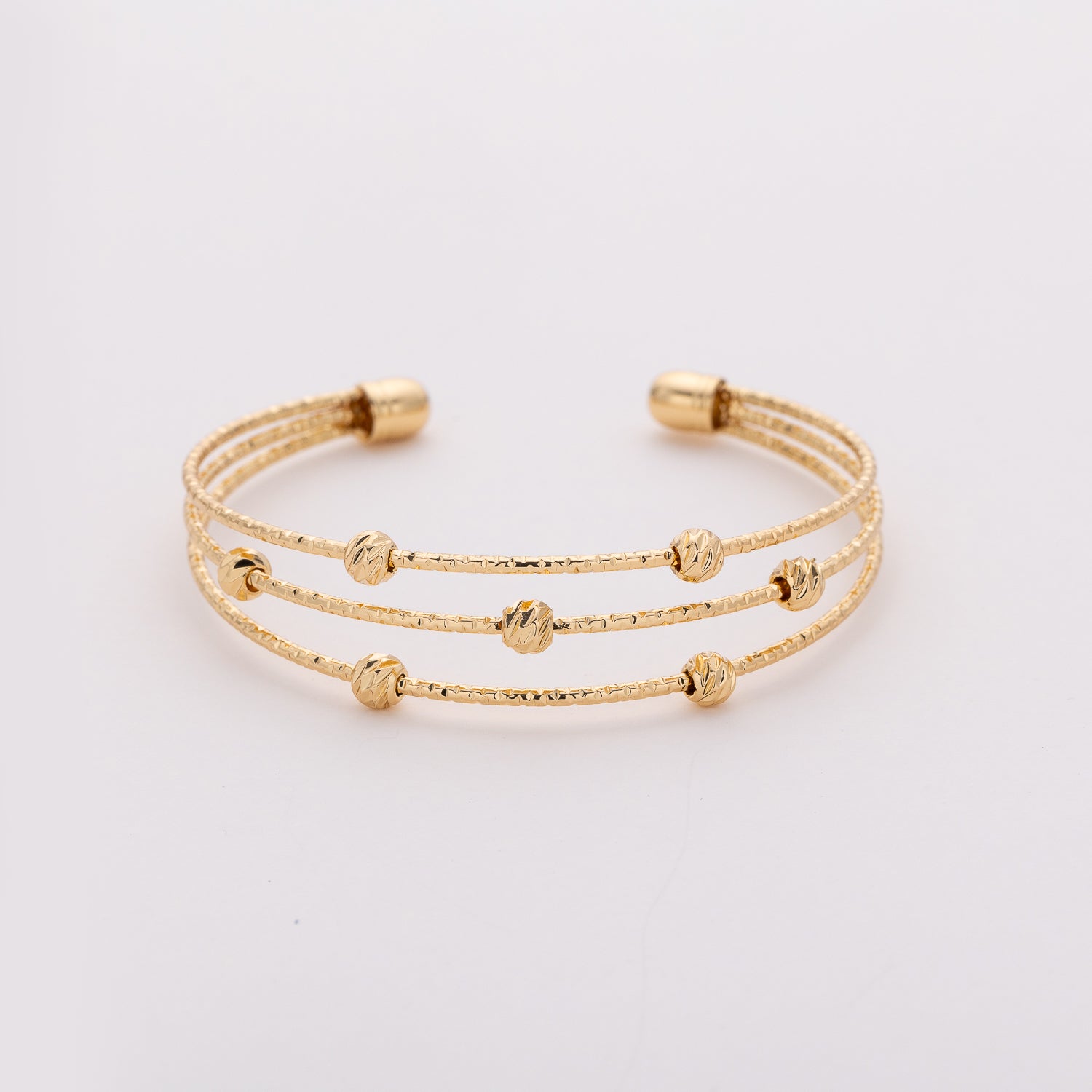pulsera semirigida 3 lineas delgadas / bolitas / dorado